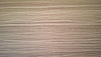 A stylized wood grain pattern with subtle, flowing lines creates a modern and abstract wood texture suitable for backgrounds and design overlays