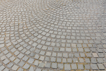 Patterned cobblestone street pavement with curved design