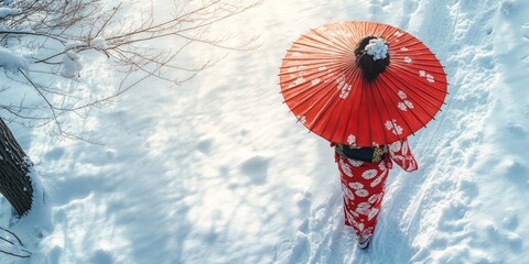 Woman wearing a red kimono is walking in the snow with an umbrella. The umbrella is red and has a design on it. The scene is peaceful and serene, with the snow covering the ground