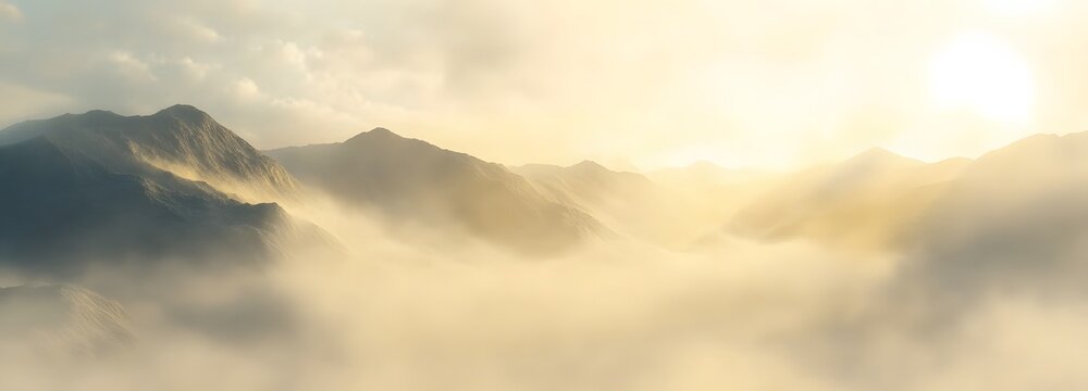 A misty morning in the mountains, with soft sunlight casting a warm glow over the fog and rolling hills below