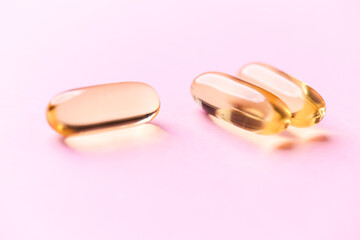 Fish oil capsules with omega 3 on bright background. Concept for a healthy dietary supplementation....