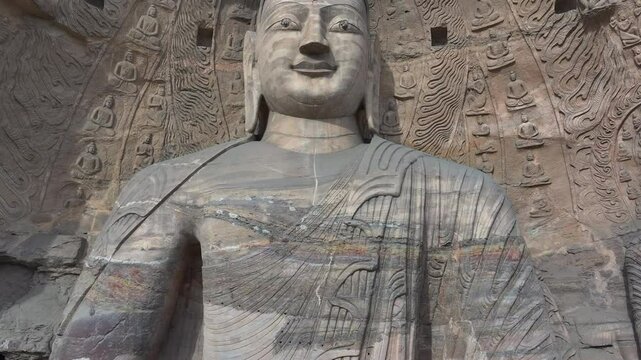 The Yungang Grottoes in Datong, Shanxi Province, China, were originally built 1500 years ago during the Northern Wei Dynasty, featuring,Ancient Buddha sculptures