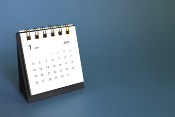 Monthly calendar template for the new year 2025 desk calendar,isolated on blue background.