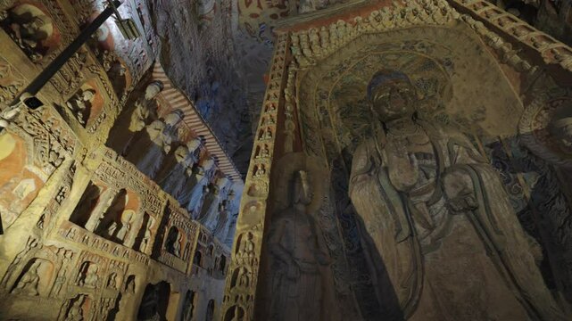 The Yungang Grottoes in Datong, Shanxi Province, China, were originally built 1500 years ago during the Northern Wei Dynasty, featuring huge and exquisite Buddha sculptures