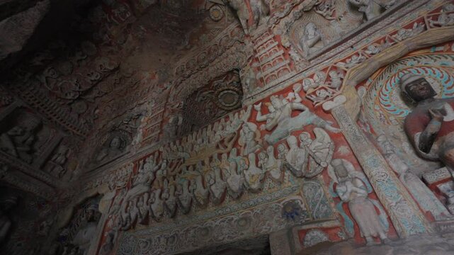 The Yungang Grottoes in Datong, Shanxi Province, China, were originally built 1500 years ago during the Northern Wei Dynasty, featuring huge and exquisite Buddha sculptures