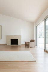 Fototapeta premium Modern minimalistic living space with large windows and natural light