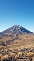 Majestic Volcano Under Clear Blue Sky in Arid Landscape