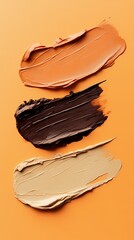 Several colors of concealer mixed with poster background