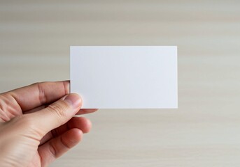 Obraz premium A minimalist image of a hand presenting a blank business card, ready for branding and marketing applications
