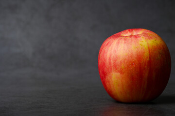 Apple close-up rendered on dark background