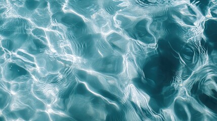 Obraz premium Clear, transparent blue water surface texture with ripples and bubbles, ideal for banners showcasing water-based beauty products, such as moisturizers and toners.