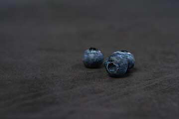 Close-up of blueberries on dark background.Fresh Blueberry Bounty. Close-up of ripe juicy blueberries filling the frame