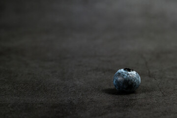 Close-up of blueberries on dark background.Fresh Blueberry Bounty. Close-up of ripe juicy blueberries filling the frame