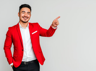 A professional man wearing a red blazer and white shirt, smiling confidently, pointing with her right hand outward to the side as if indicating a message or text.