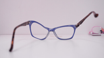 Broken eyeglasses. Assortment of broken glasses, broken hinges, missing lenses, cracked frames,...
