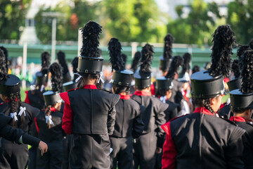 Rear school marching band in formal uniform in sport day