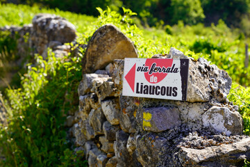 Signpost to via ferrata liaucous a mountaineering trail in france Mostuejouls near Millau