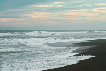 waves breaking on the beach. Ocean waves breaking on a  beach. Close up shot of breaking wave Pandansari beach, Central Java, Indonesia.
