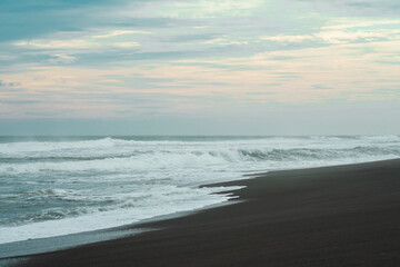 waves breaking on the beach. Ocean waves breaking on a  beach. Close up shot of breaking wave Pandansari beach, Central Java, Indonesia.
