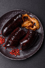 Delicious black blood sausage or black pudding with spices and herbs