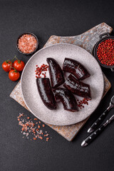 Delicious black blood sausage or black pudding with spices and herbs