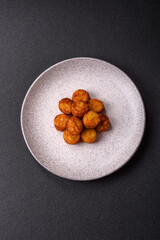 Delicious fried potato balls or croquettes with salt, spices and herbs