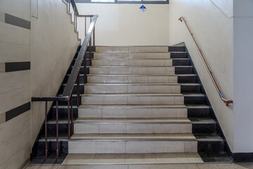 A staircase architecturally connecting upper and lower floors, creating a vertical link between spaces.