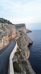 Coastal road with rocky cliffs and sea view