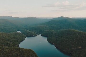 Obraz premium Aerial View of Serene Mountain Landscape with Calm Waters and Forests