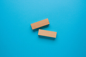 Blank wooden blocks on a blue background that can be written on