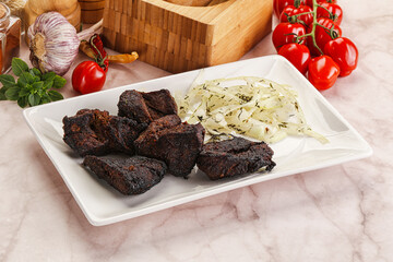 Grilled beef barbecue served onion