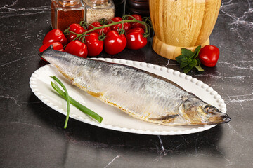 Whole raw salted herring fish