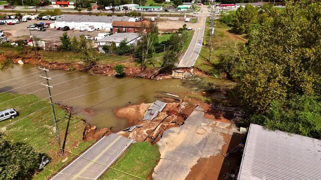 Cinematic drone shot of bridge washed out by Hurricane Helene. Swannanoa, NC - Asheville area.