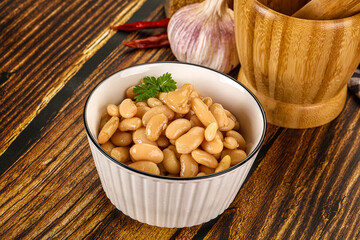 Baked white canned beans in the bowl
