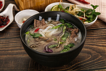 Vietnamese Pho Bo soup with beef and noodles