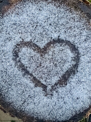 Heart Shape Drawn in Frost on a Wooden Surface. High quality photo