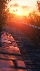 A scenic view of a winding stone path at sunset, capturing the warm glow of the sun along the ancient wall.