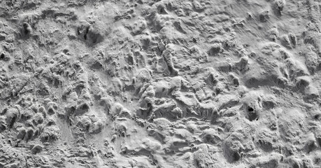 Sliding stone plaster in the image of a lifeless cold desert in the form of abstraction