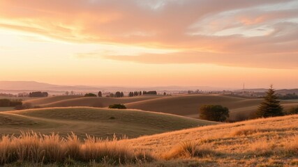 Serene Sunset Over Rolling Hills and Golden Grasslands