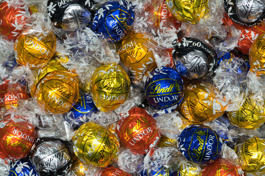 Lindt Lindor chocolate truffles in wrappers scattered flat lay Houston, Texas USA 01-01-2025.