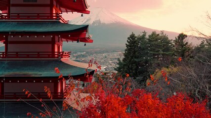 A mesmerizing view of Chureito Pagoda surrounded by vivid red foliage at the peak of autumn, with Mount Fuji standing prominently in the background.