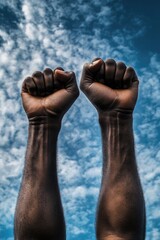 Hands against blue sky