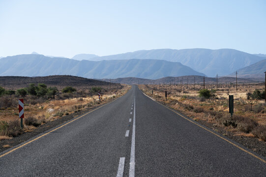 A long empty tar road in the Klein Karoo of South Africa