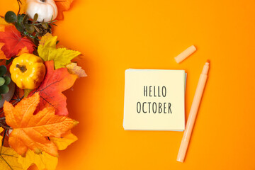 Notes with words Hello october and fall leaves. Concept of beginning of autumn and new season