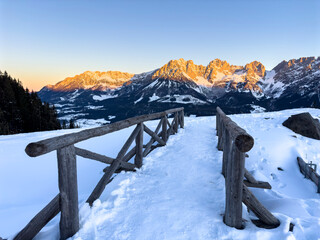 Alpenglow at the Wilder Kaiser with wooden bridge, Going, Tyrol, Austria