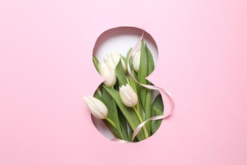 Obraz premium Paper cut out figure eight on pink background with fresh tulips. Concept of 8 march, Women's day