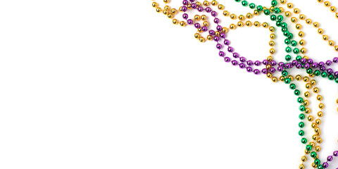 Mardi gras beads on white background © Anna