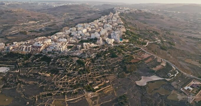 Aerial view cityscape of Zebbug island of Gozo Malta. Architecture of a Mediterranean city with historic streets on the seashore. High quality 4k footage