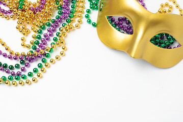 Mardi gras beads frame on white background © Anna