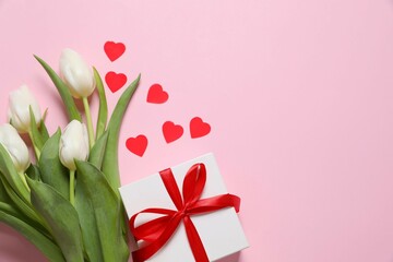 Beautiful fresh tulips with gift box on color background